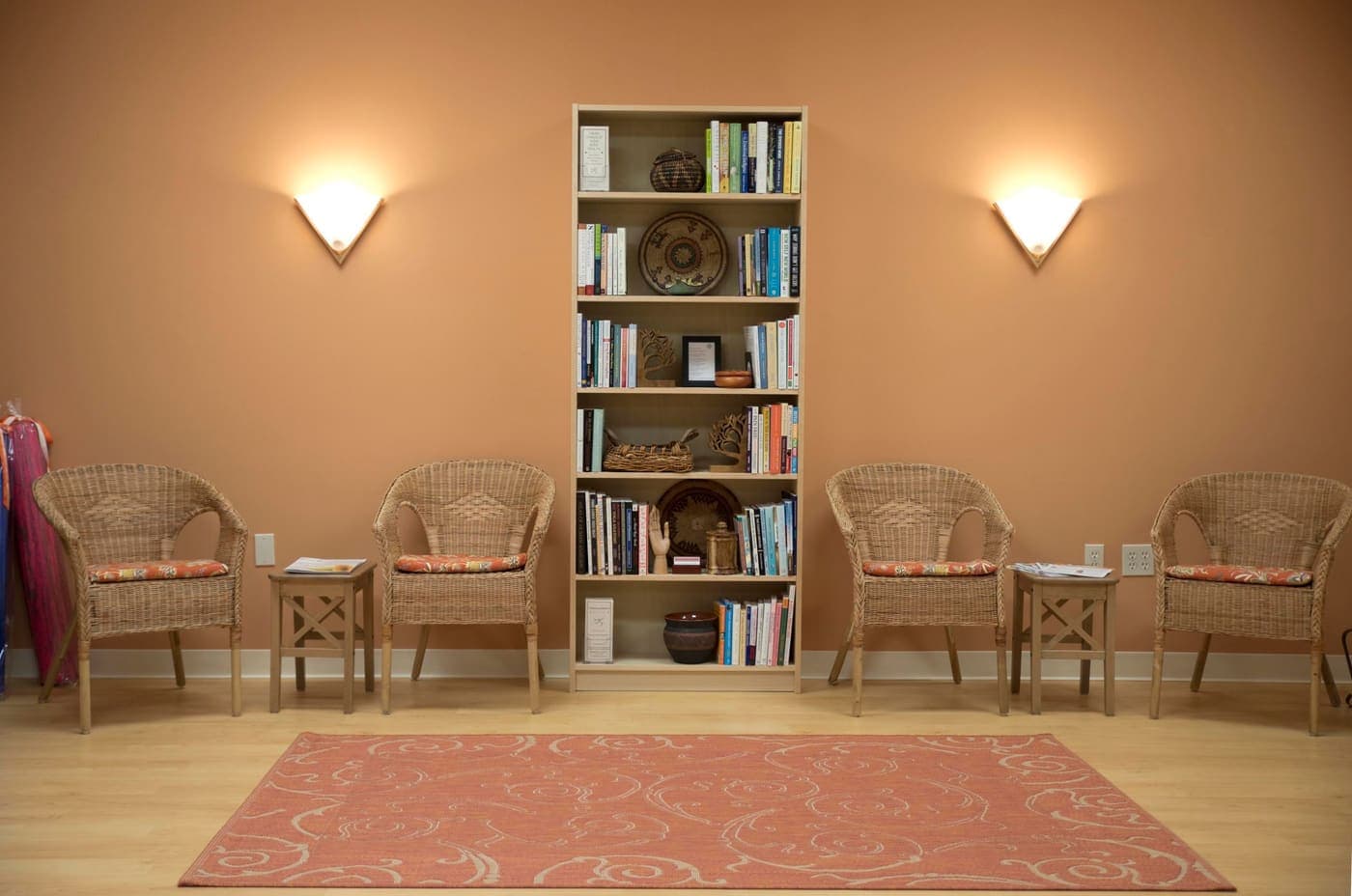 The waiting area at Mindful Physical Therapy, with armchairs and a bookshelf